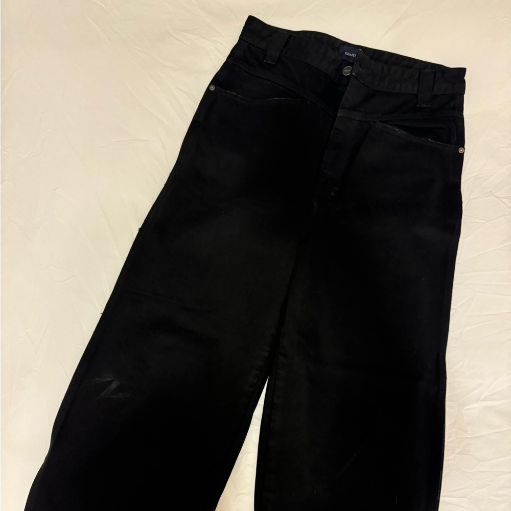 Khaite black barrel leg jeans